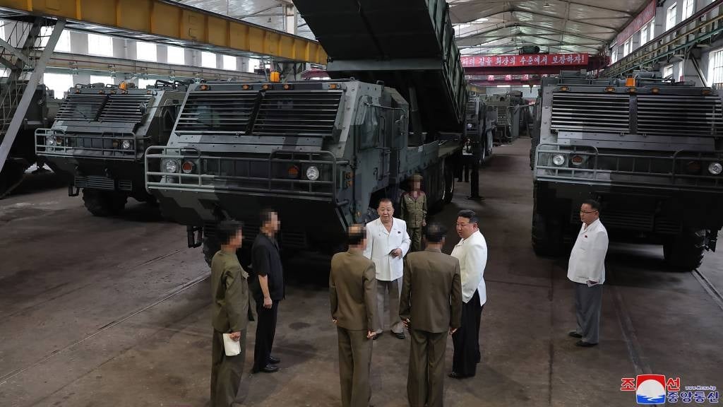 This undated photo released from North Korea's official Korean Central News Agency (KCNA) shows North Korea's leader Kim Jong Un (2nd R) during a visit to an important munitions factory at an undisclosed location in North Korea. (KCNA via KNS/AFP)
