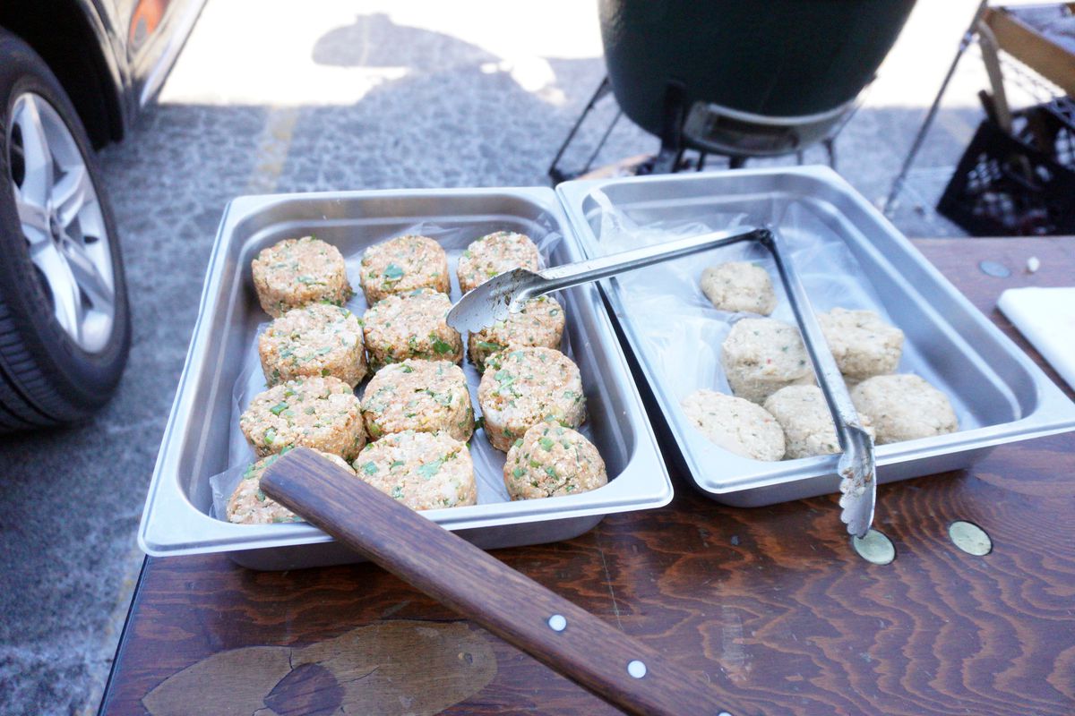 Two metal dishes full of fish patties.