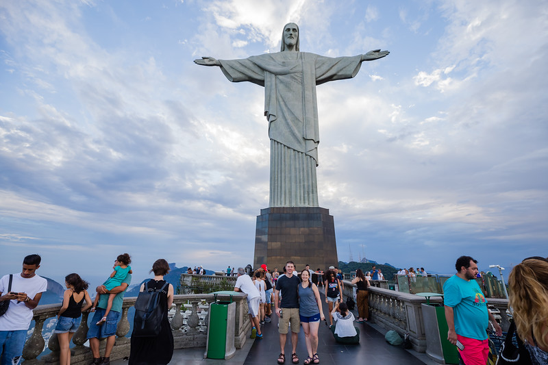 Lina & David Stock standing in front of the Christ the Redeemer Statue in Rio de Janeiro, Brazil