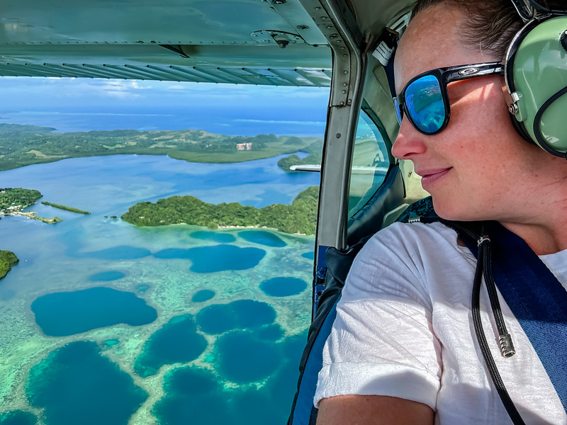 Lina Stock looking out of an airplane in Palau over the Rock Islands