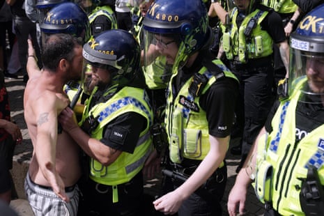 Police clash with right wing demonstrators in Piccadilly Gardens, Manchester, on Saturday.