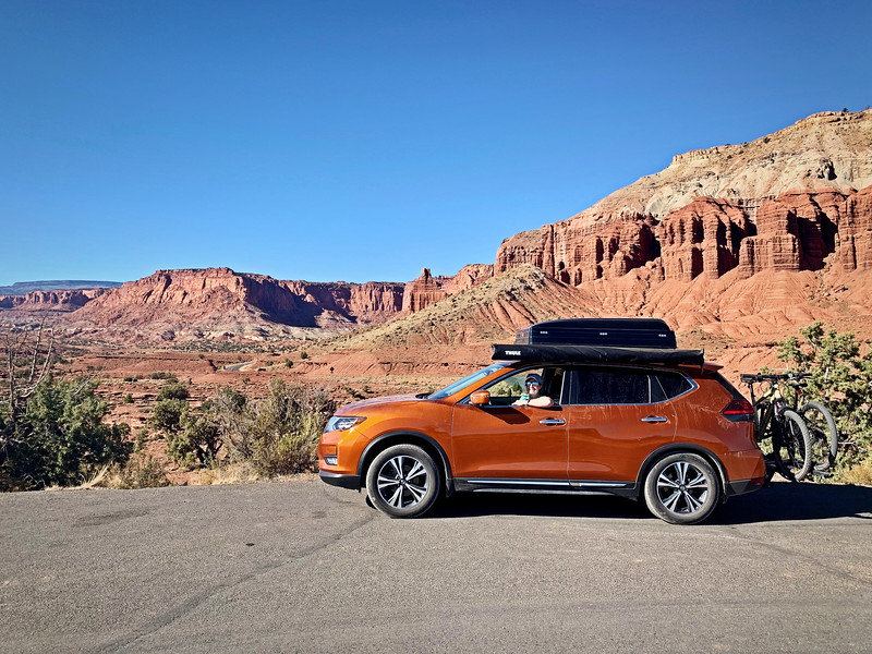 Lina Stock in a Nissan Rouge outfitted for overland travel with a Roofnest on it.