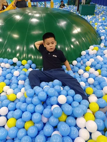Miguel enjoying the ball pit at Kidzooona Robinsons Galleria
