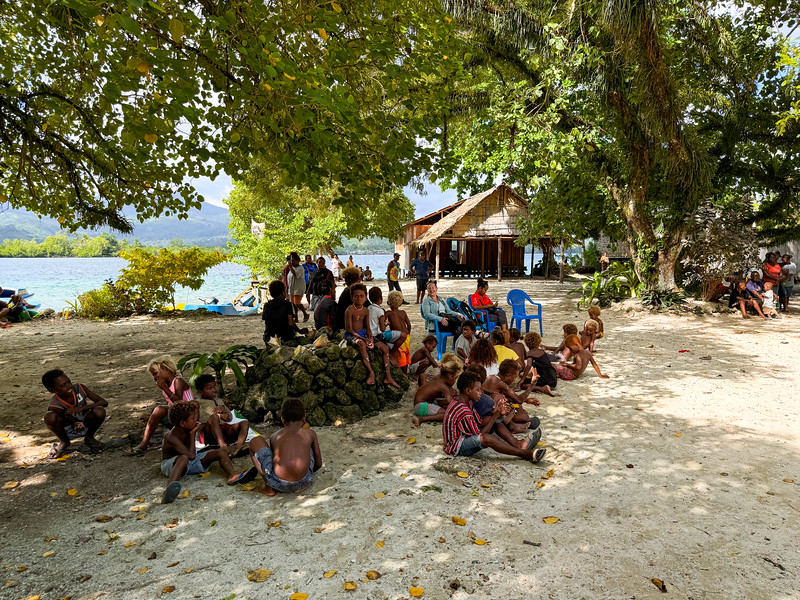 Lina Stock sitting with local people at the Shell Money Festival in Busu Village, Langa Langa Lagoon, Malaita, Solomon Islands