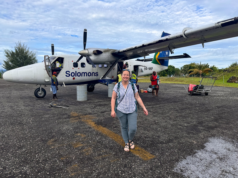 Lina Stock walking away from an airplane on the Gizo airstrip in Solomon Islands