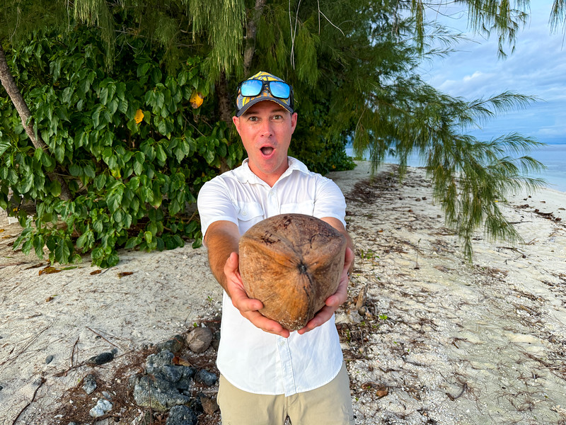 David Stock with a coconut at Kennedy Island in the Solomon Islands