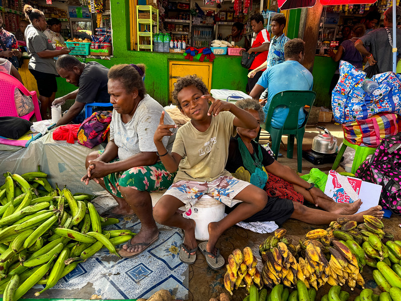 People smiling at the Honiara Central Market in Solomon Islands