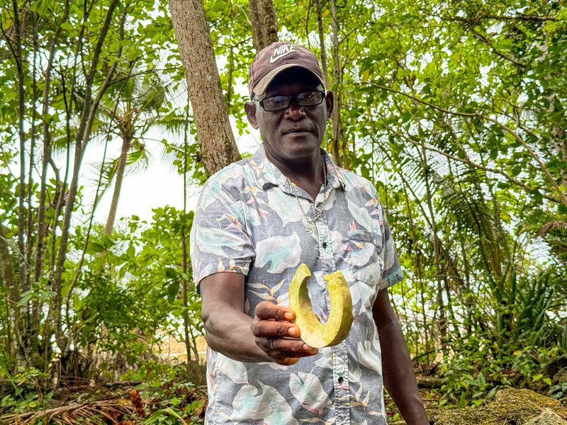 Skull Island guide showing traditional stone money in the Solomon Islands