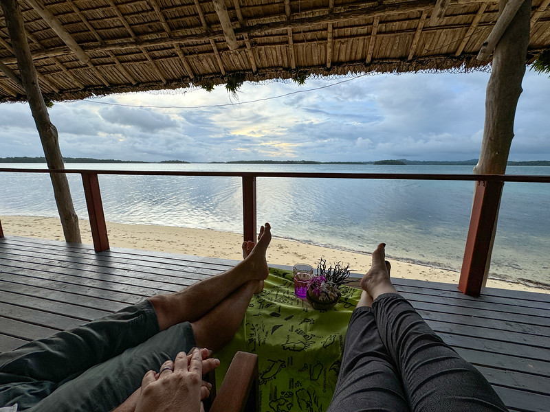 Couple watching sunset at Zipolo Habu Resort, Munda, Solomon Islands