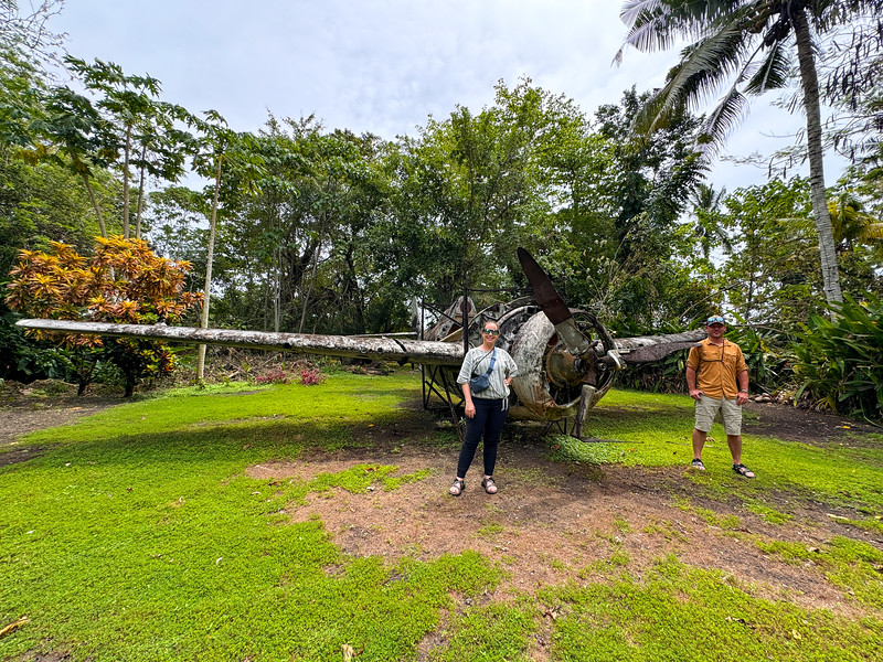 Lina Stock and David Stock with a WWII war plane at the Vilu War Museum on Guadalcanal, Solomon Islands