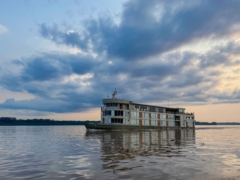 Delfin Luxury Amazon River Cruise - Delfin III sailing on the Amazon River in Iquitos, Peru