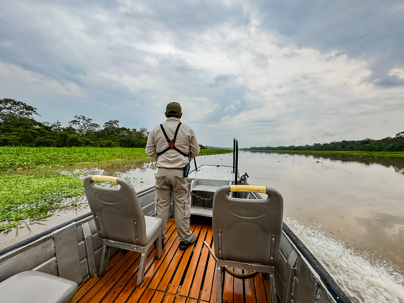 Delfin III Amazon naturalist guide on a skiff near Iquitos, Peru