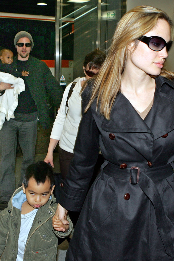The actors – with son Maddox and baby daughter Zahara in 2005 at Tokyo airport – battled over custody of their six children and the division of assets.