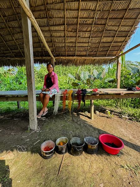 Woman doing a yarn dying demonstration in the Amazon Rainforest near Iquitos, Peru