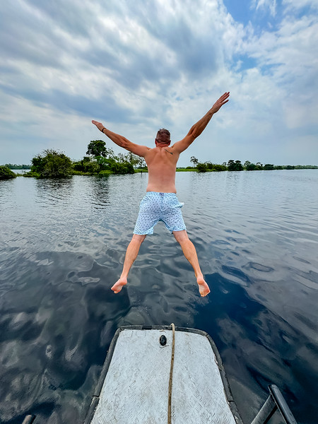 David Stock jumping into the Ucayali River in Iquitos, Peru