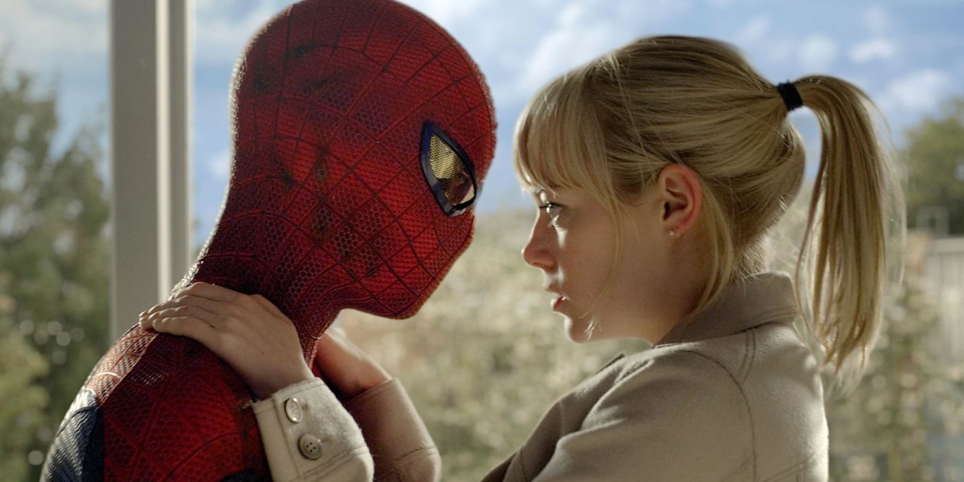 Emma Stone and Andrew Garfield as Spider-Man embrace in The Amazing Spider-Man