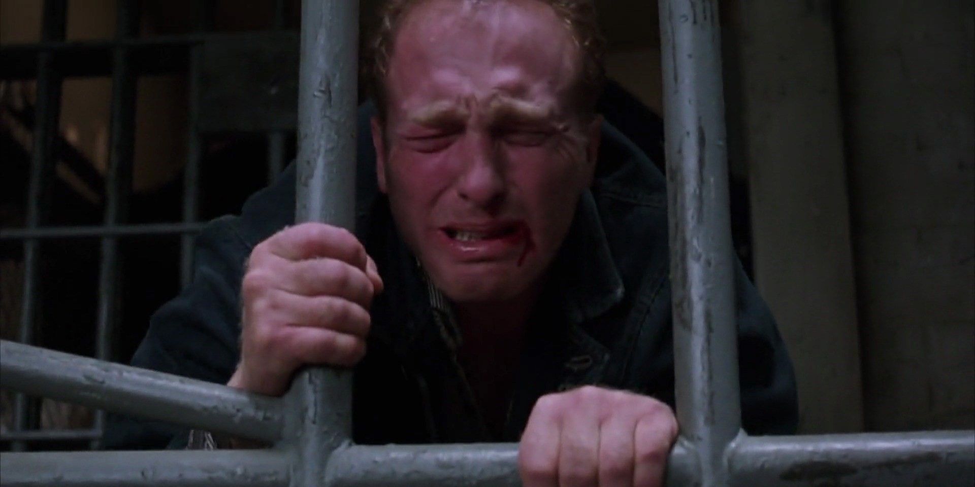 bogs-holding-onto-prison-bars-in-the-shawshank-redemption
