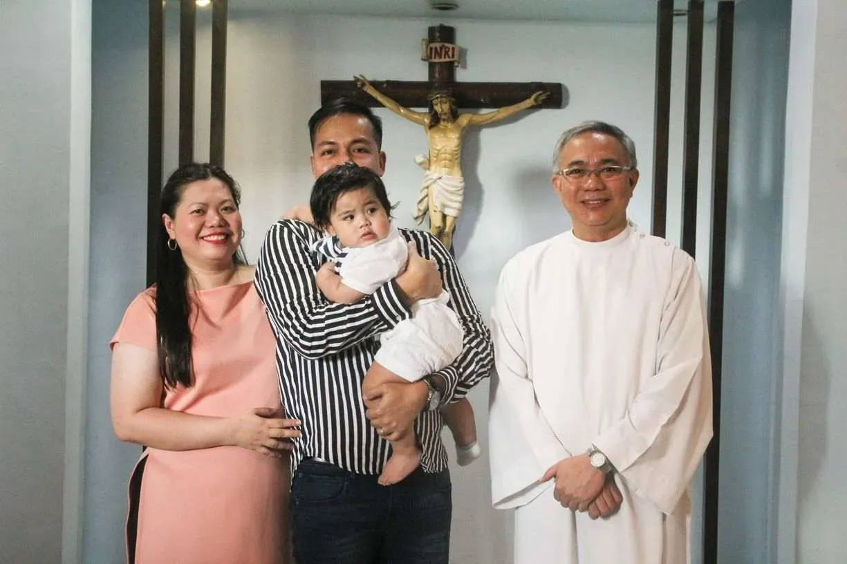 Family photo after Miguel's baptism