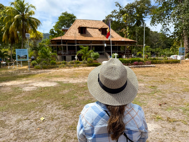 Lina Stock looking at the estate house on the L'Union Estate, La Digue, Seychelles