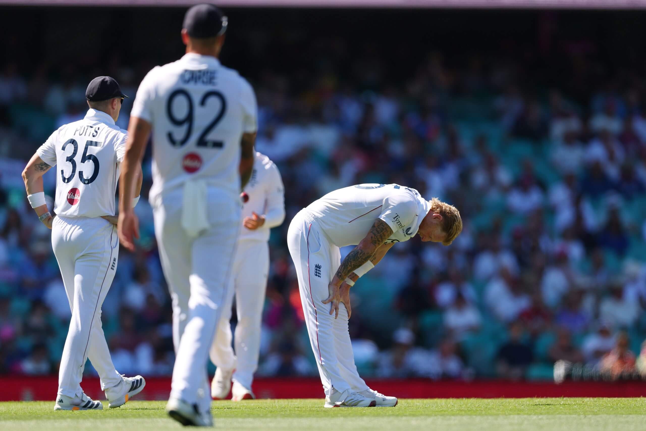 Ben Stokes stands hunched with hands on knees after sustaining a groin injury