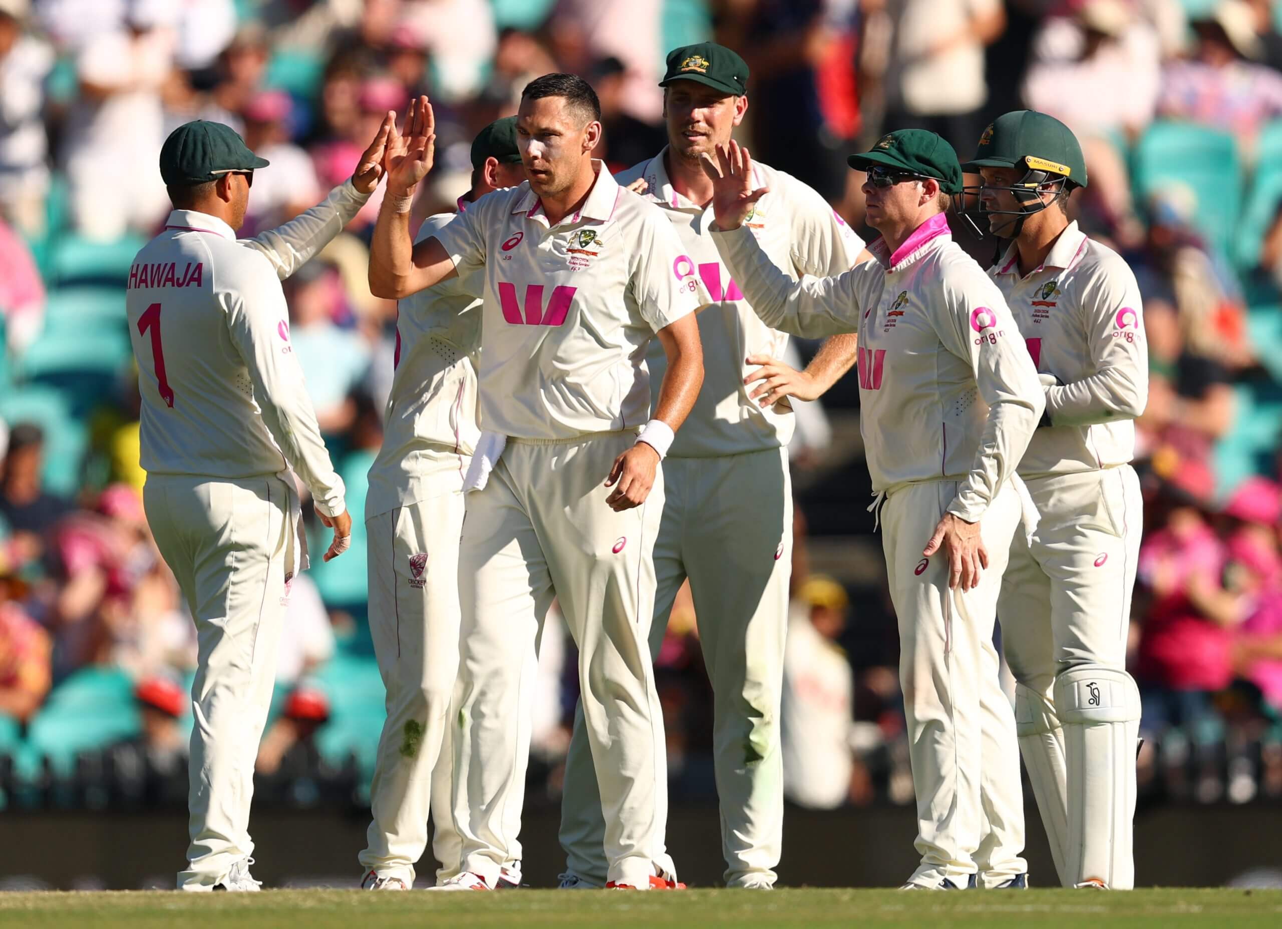The excellent Scott Boland is congratulated by his Australia team-mates